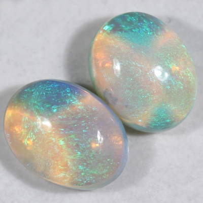 SOLID CRYSTAL OPALS Matching pair, 3D pattern. Bright green fire throughout